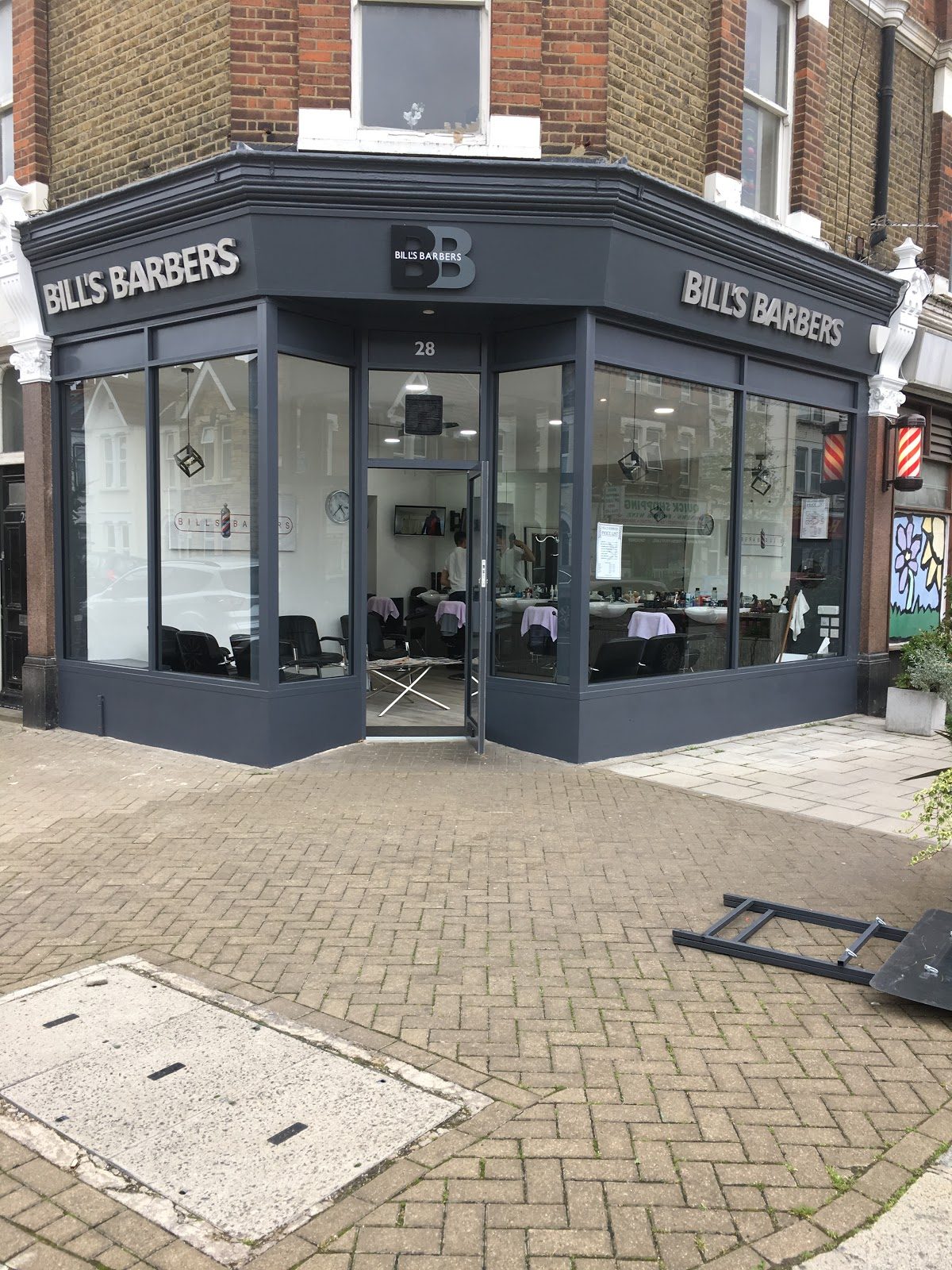 Corner view of Bill's Barbers shopfront on Staplehurst Road